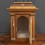 18th century tabernacle decorated with 2 columns and a sun on the facade