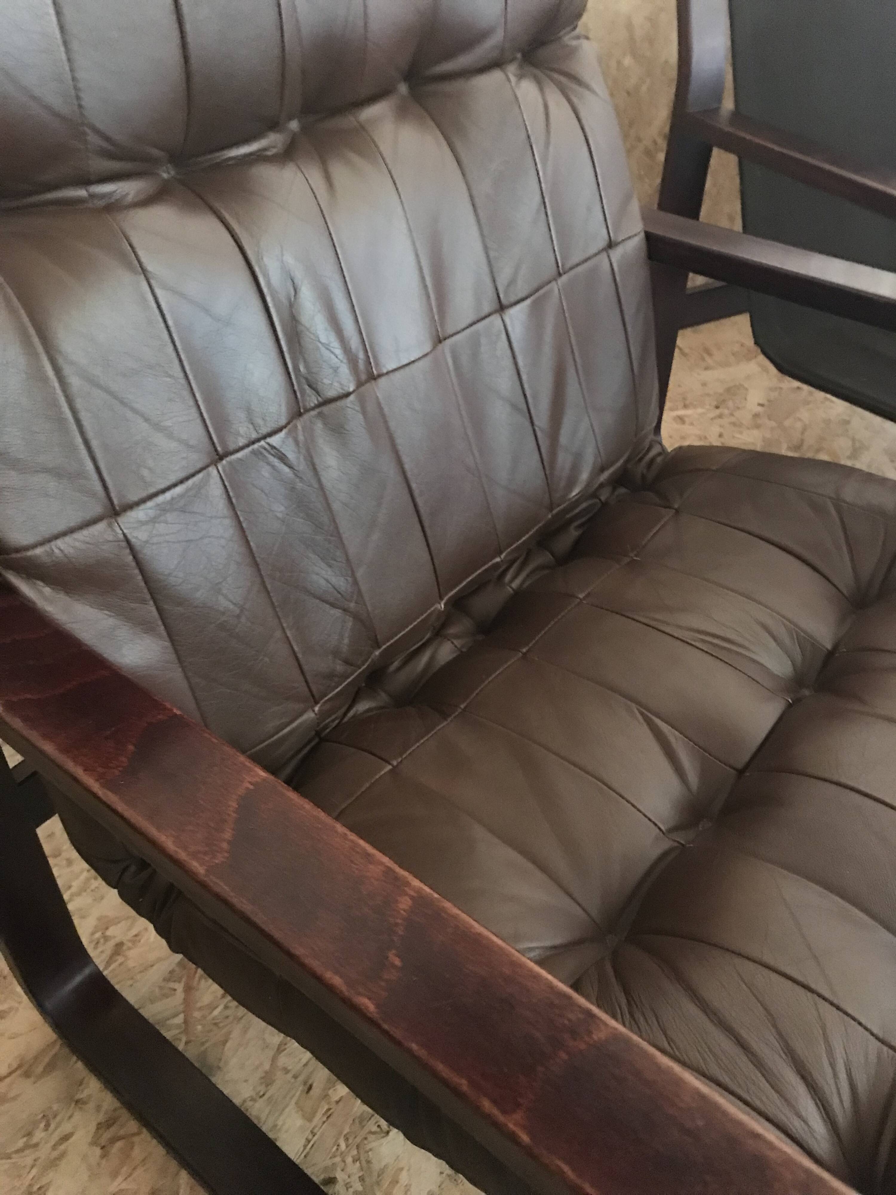 Pair of vintage armchairs in curved wood with suspended seat circa 1970-80.