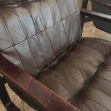 Pair of vintage armchairs in curved wood with suspended seat circa 1970-80.