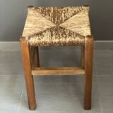 Wooden stool with straw seat