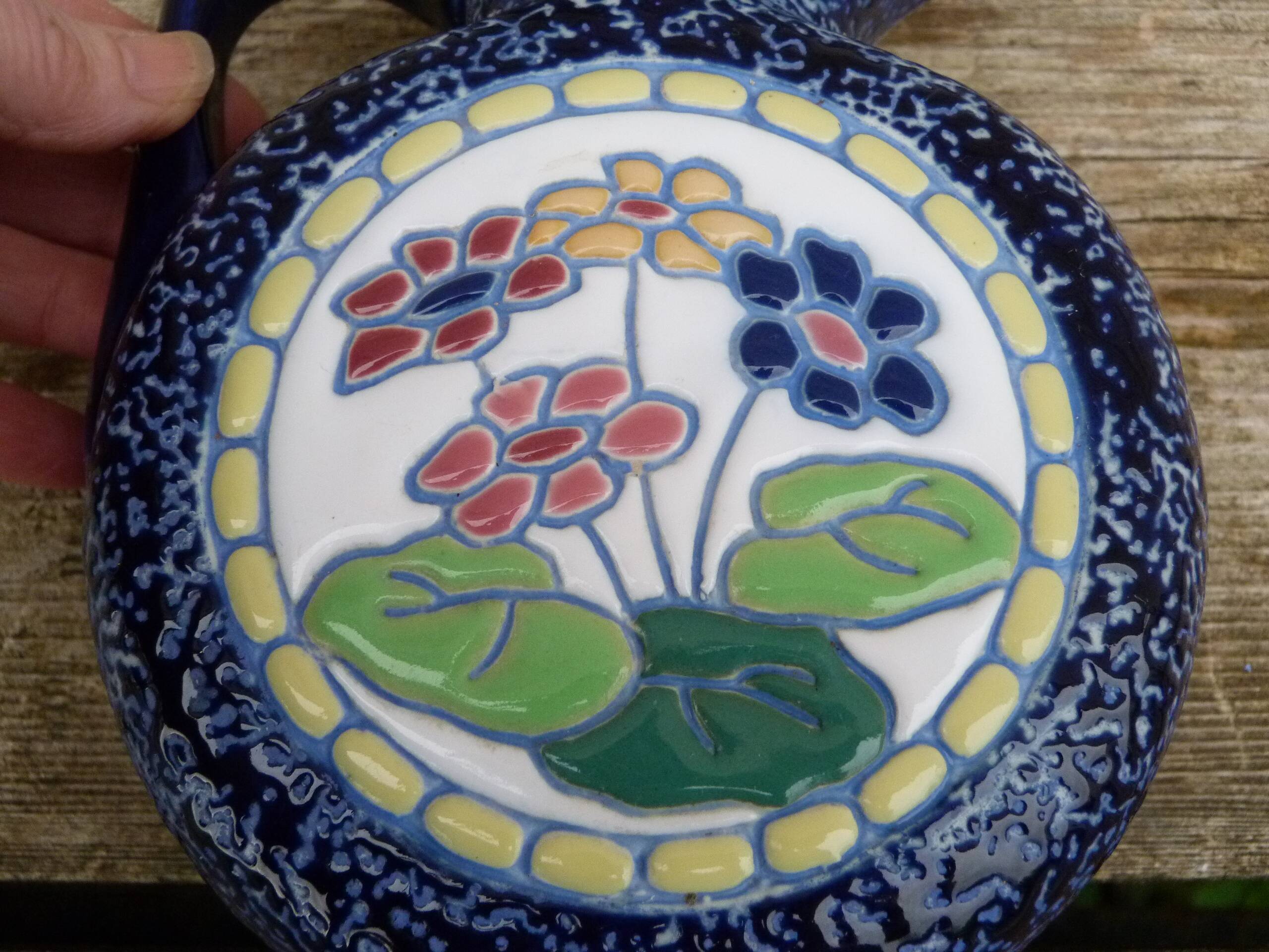 Blue ceramic vase with floral motifs