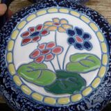 Blue ceramic vase with floral motifs