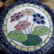 Blue ceramic vase with floral motifs