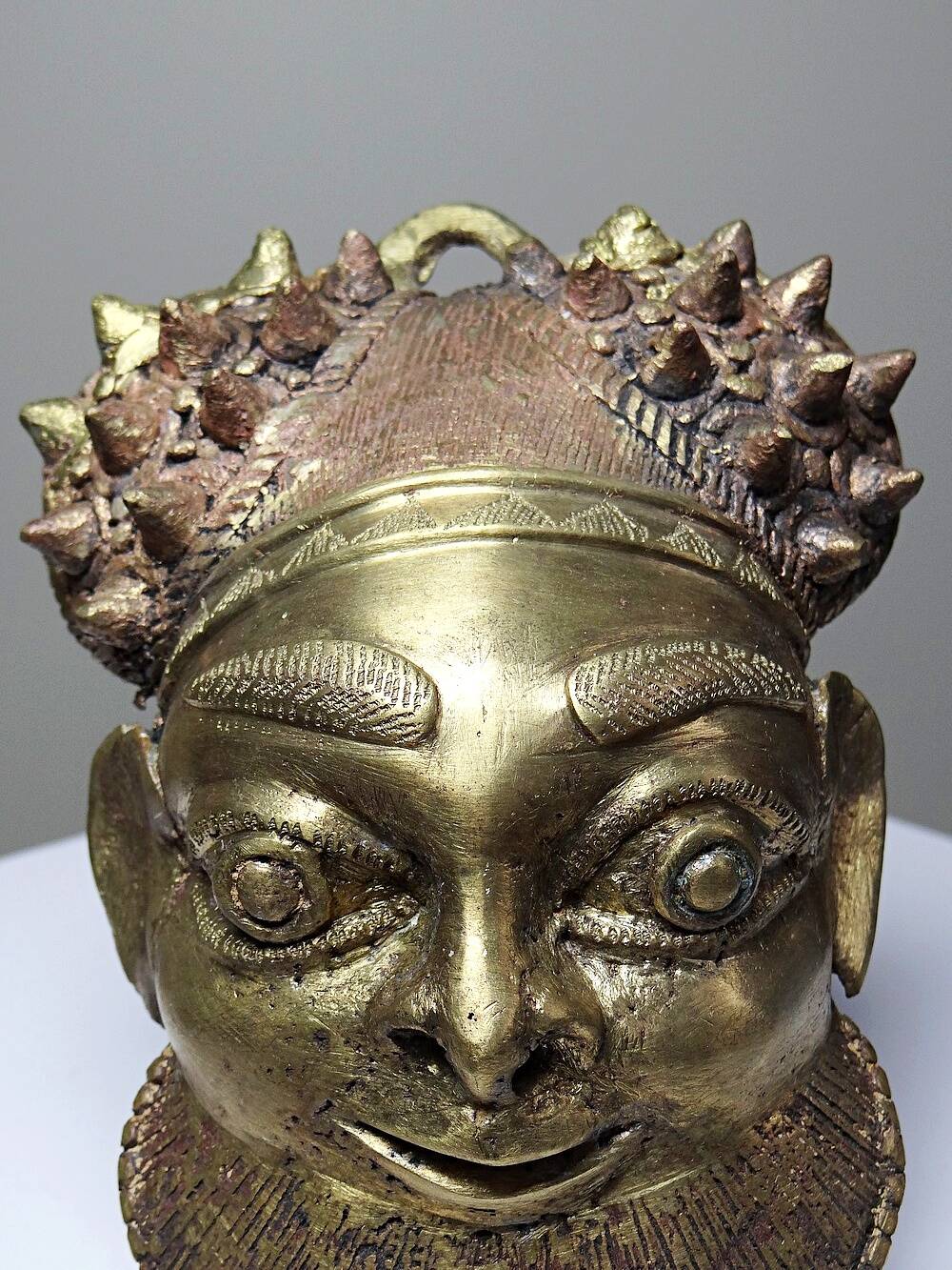 Small gilded bronze Oba mask from Bamoun, Cameroon, vintage Africa