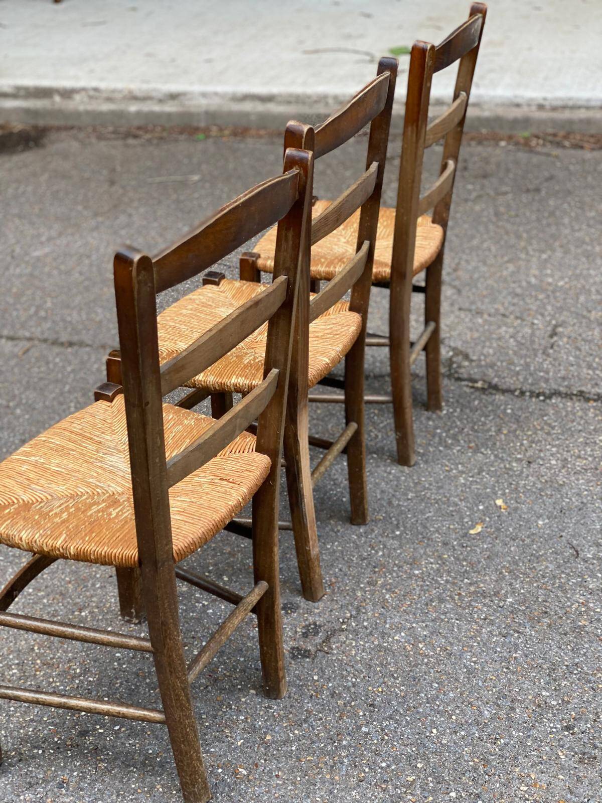 3 solid wood and straw chairs