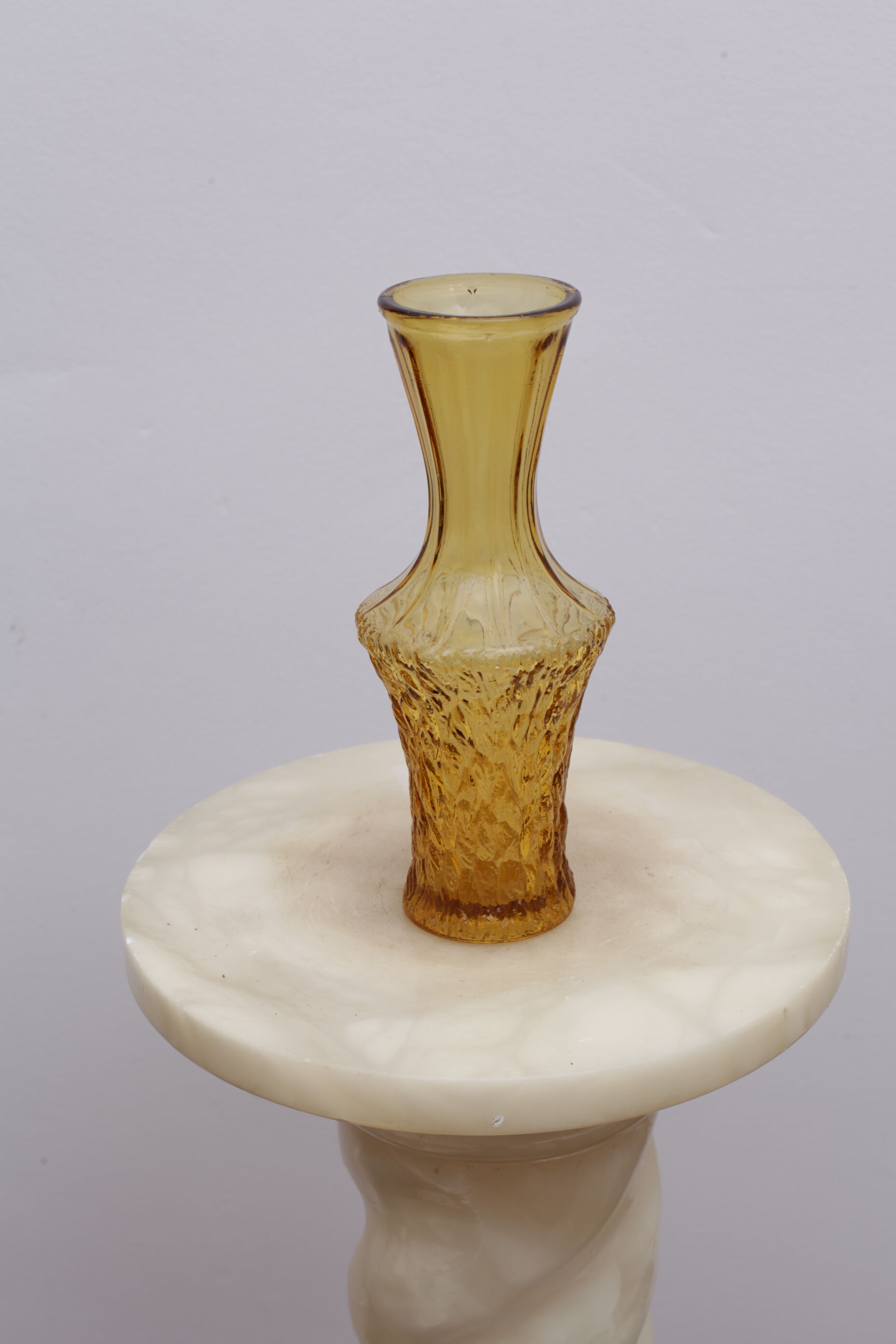 Yellow glass vase streaked and flared