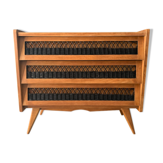 Vintage dresser with wicker decorations
