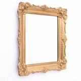 Mirror in a decorative gold frame