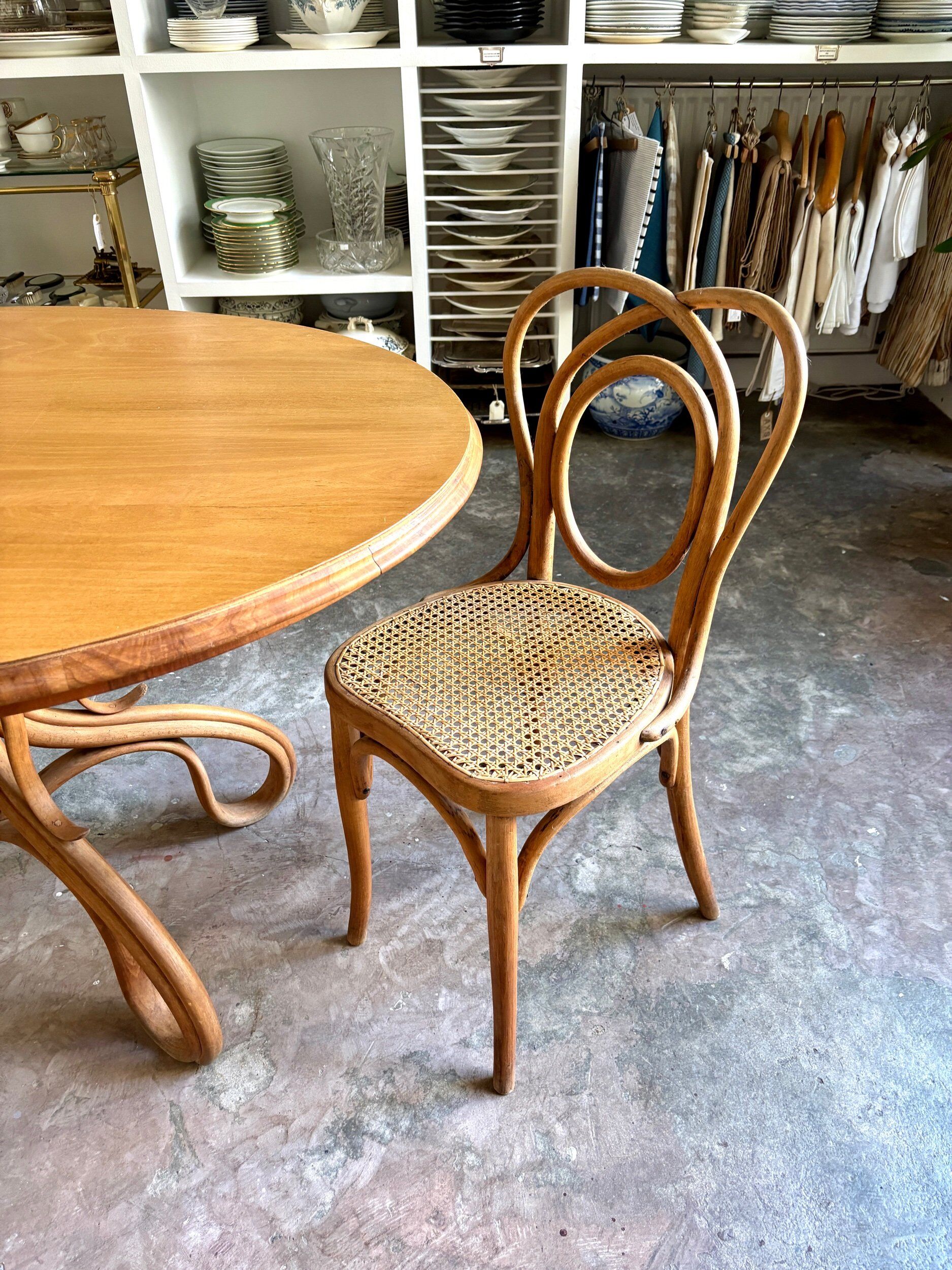 Thonet table no. 3 and 4 bent beech chairs with caning, circa 1890.