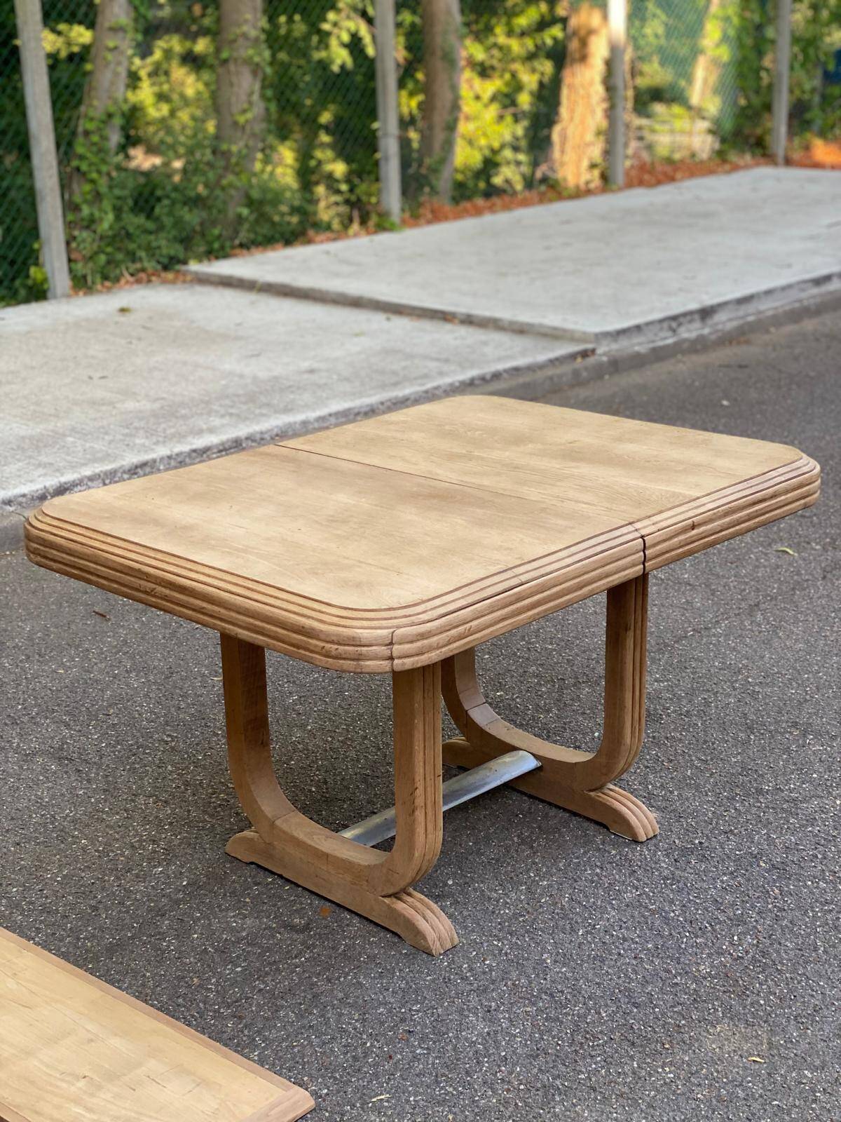 Art Deco dining table with a central pedestal, stripped in solid oak, with 2 extensions.