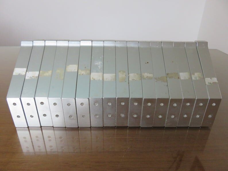 Series of 16 70s aluminium pads