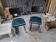 Pair of chairs with chrome tube in petrol blue.