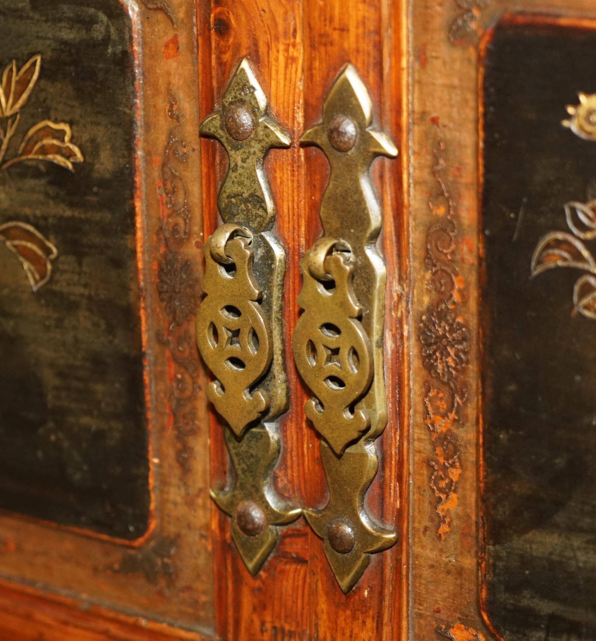 Antique Chinese armoire hand-carved around 1880 with country-style handles.