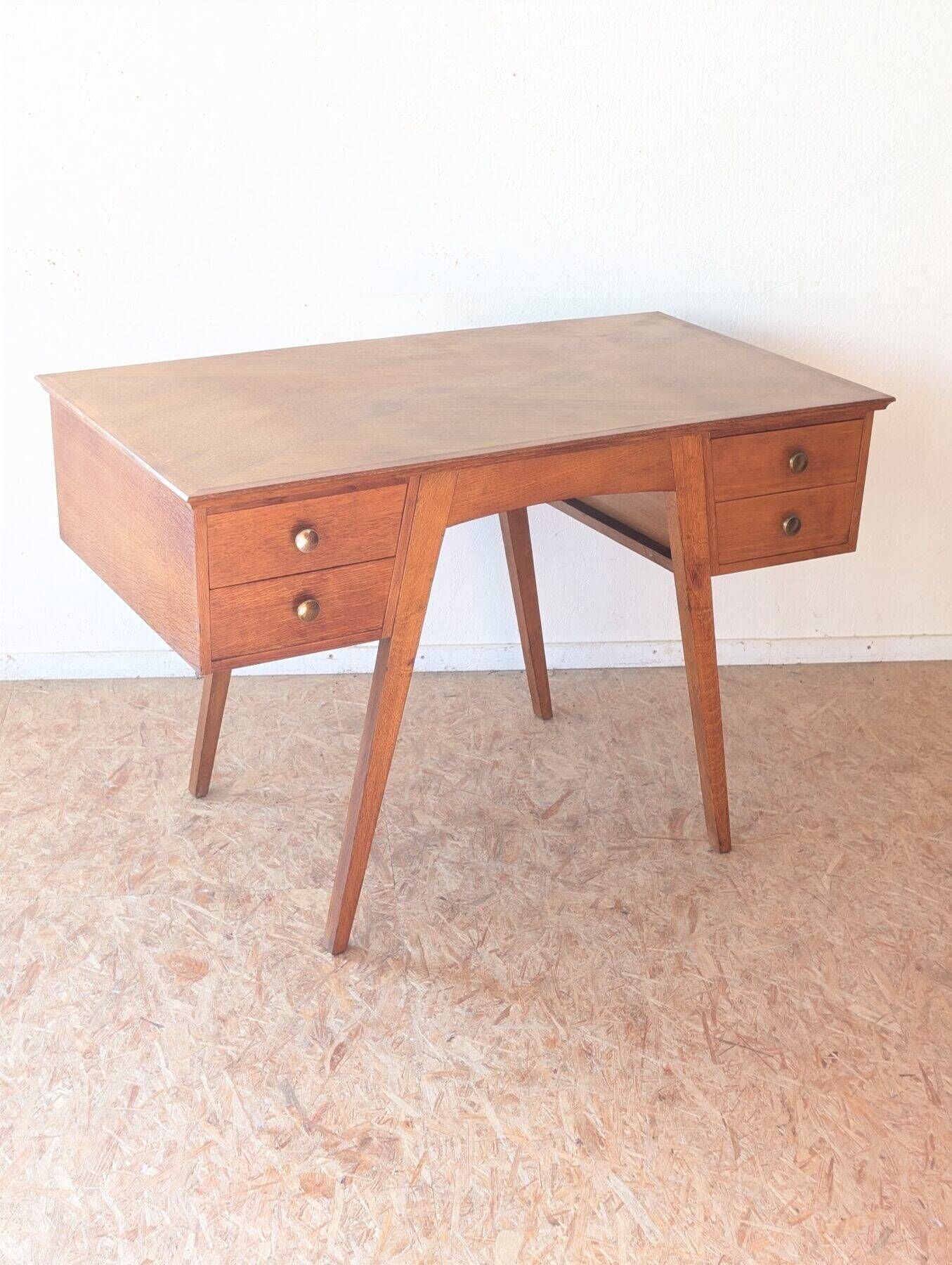 1950s oak double-sided desk with compass legs.