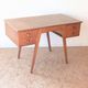 1950s oak double-sided desk with compass legs.