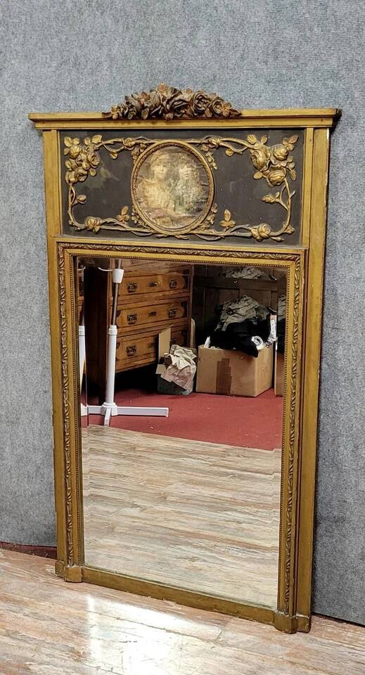 Louis XVI style trumeau mirror in wood and gilded stucco circa 1880