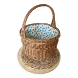 Wicker basket with waxed canvas blue flowers