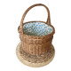 Wicker basket with waxed canvas blue flowers