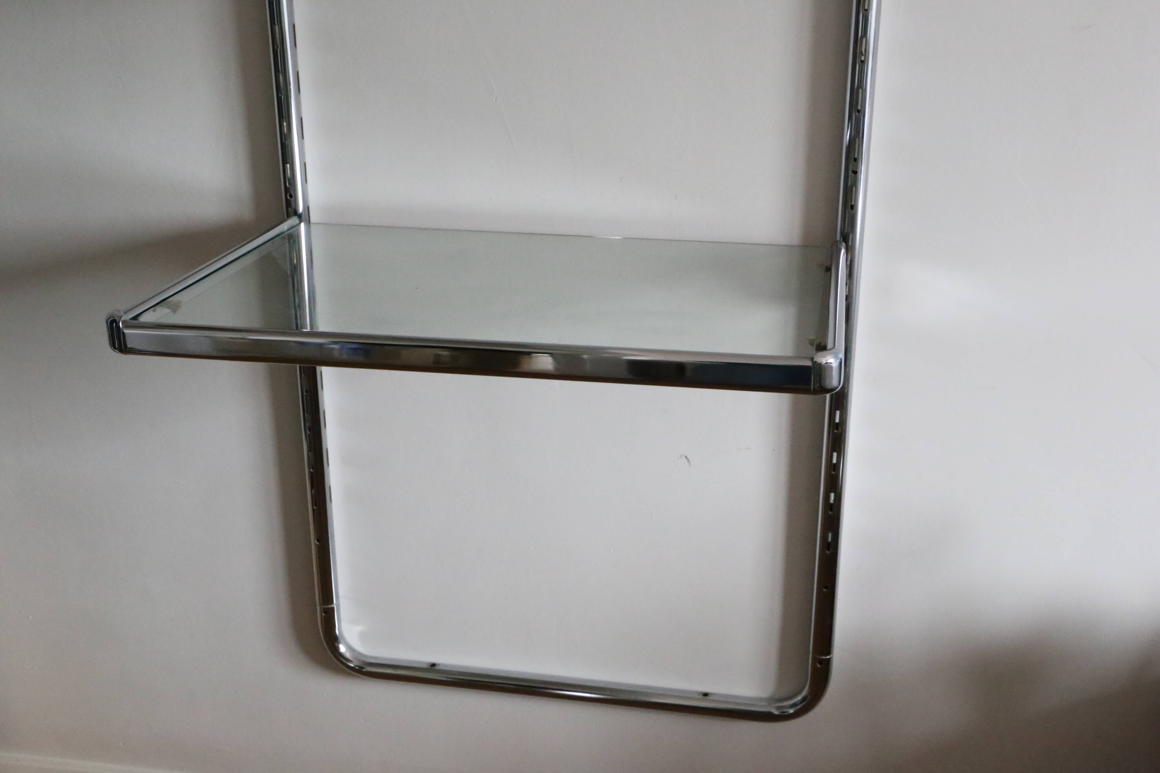 Chrome and glass wall shelf, circa 1960