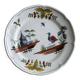 Hand-painted earthenware plate with landscape and bird decoration.