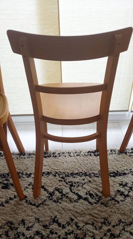 Set of 4 light wood bistro chairs stamped Baumann and Thonet.