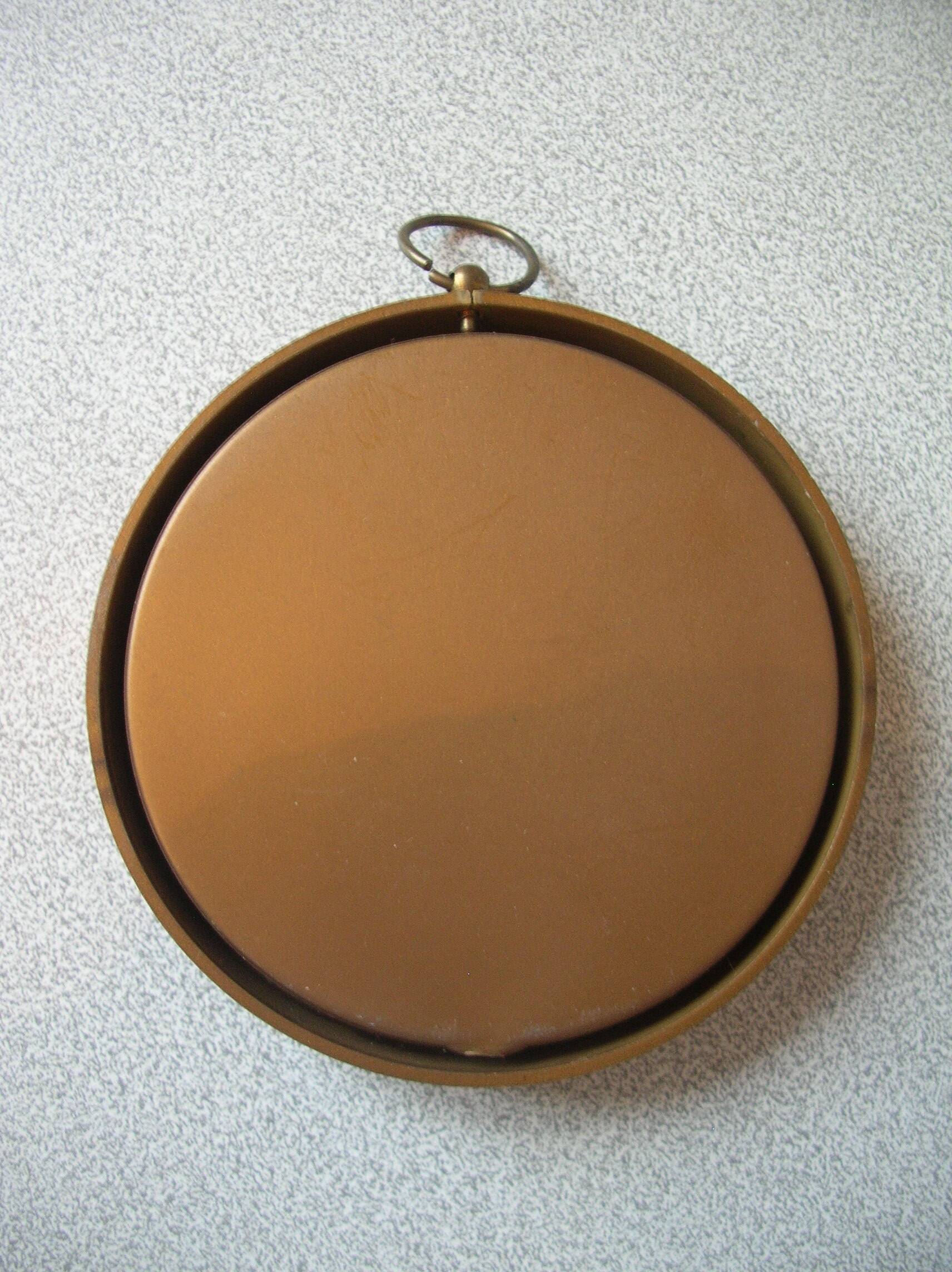 Old medallion frame bouquet of dried flowers glass and plastic retro decoration