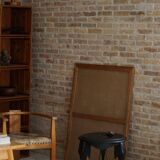 Side table in hardwood ebony with three elephant head-shaped legs, Eastern India, 1920s.