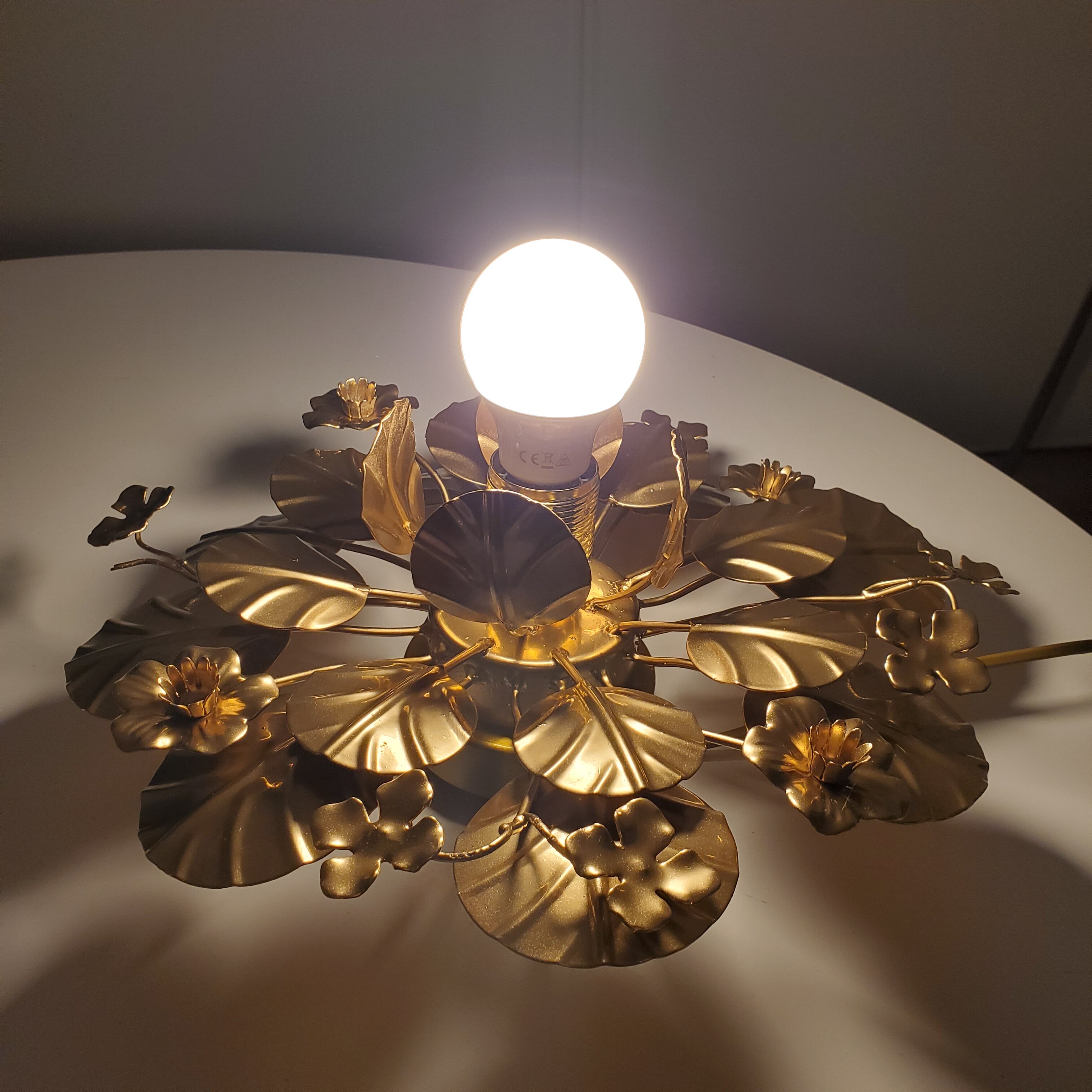 Golden metal flower sconces