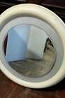 1970s mirror with integrated lighting, futuristic design, vintage wood.
