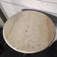 Bistro standing table with marble top and cast iron base.