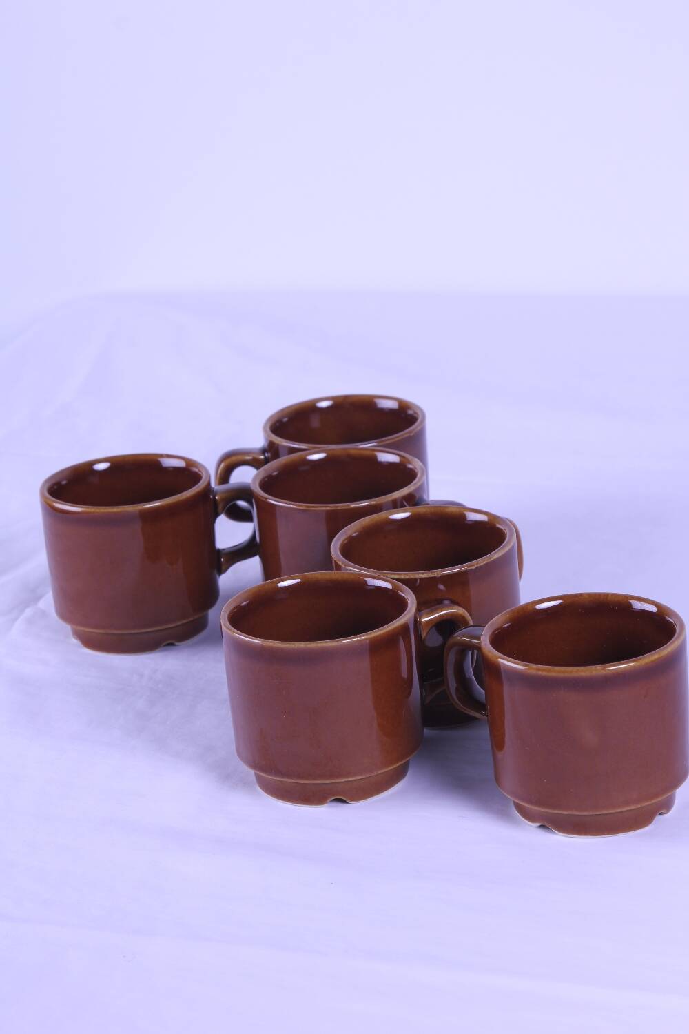 6 brown stackable coffee cups