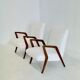 Italian mid-century lounge chair in cherry wood with white bouclé