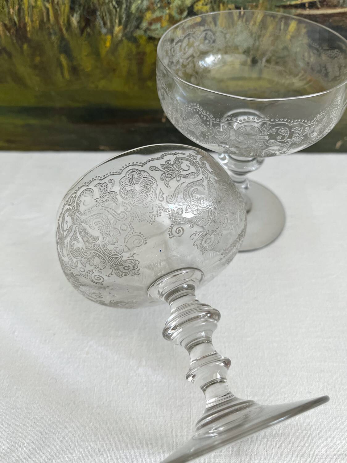 2 antique champagne glasses in engraved glass