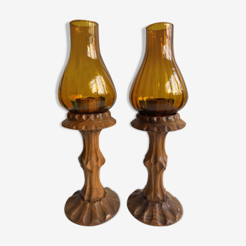 Pair of wooden candlesticks and amber glass