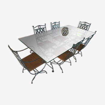 Wrought iron table with glass top, duckbill profile and 6 armchairs