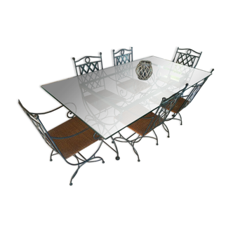 Wrought iron table with glass top, duckbill profile and 6 armchairs