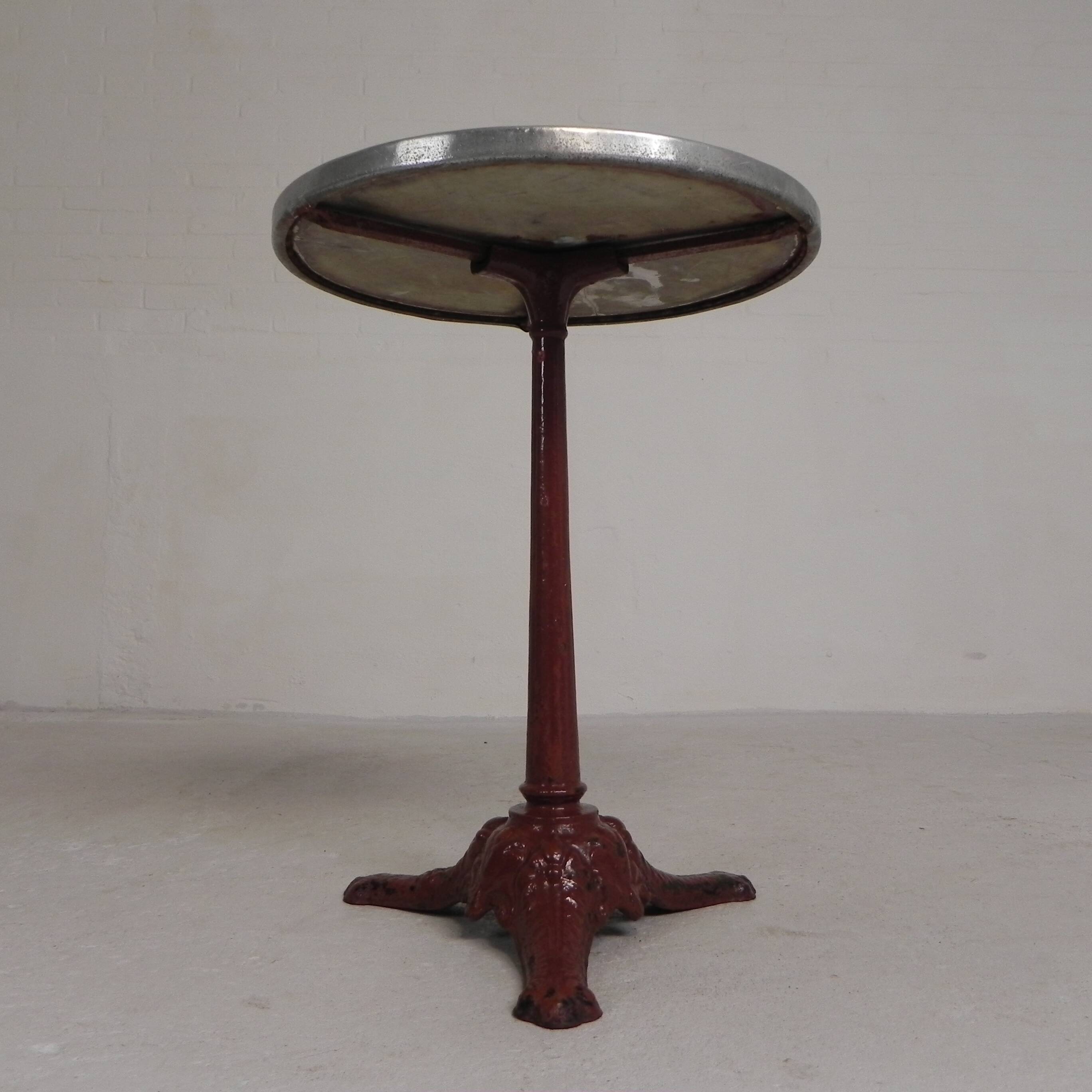 Bistro table with cast iron legs and marble top, 1920s.