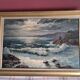 Large old oil painting depicting a seascape.