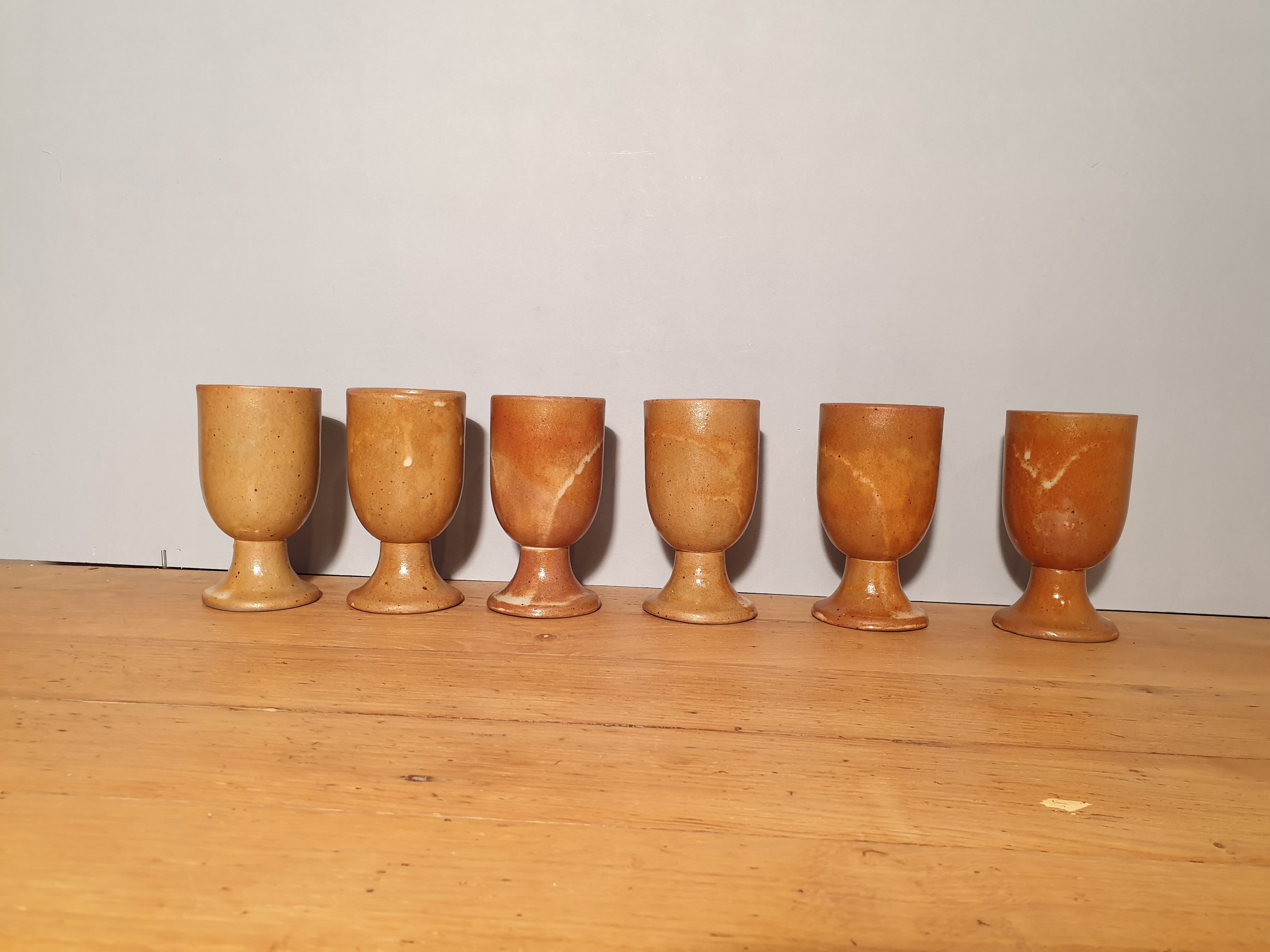 Set of 6 sandstone foot glasses