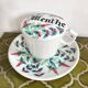 Antique herbal tea cup with mint infusion