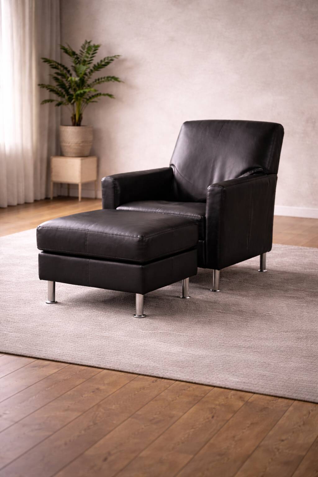 Modern Lounge Armchair with Matching Footstool — Black Leather