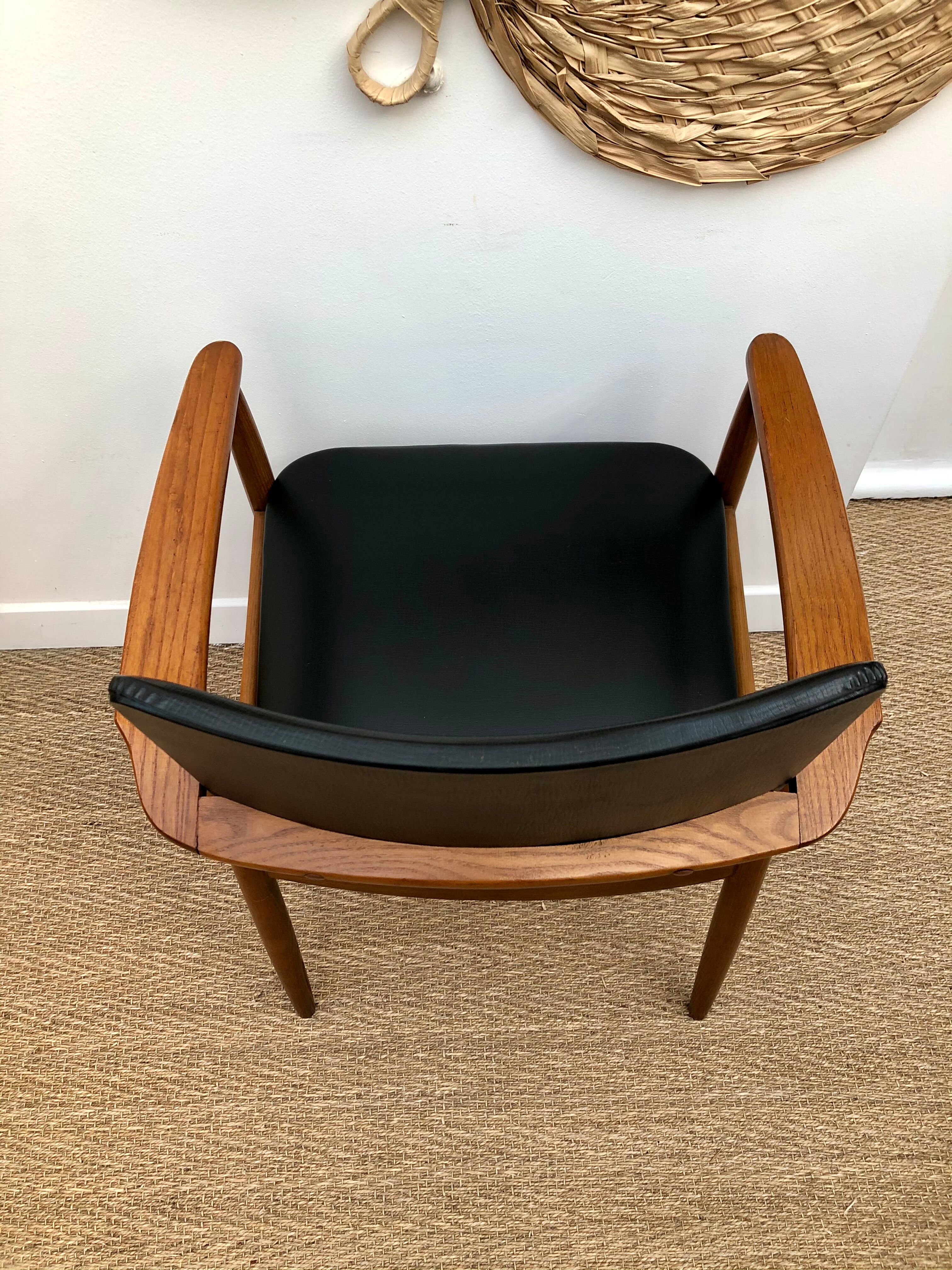 Teak and black vinyl chair 1960s