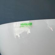 Guzzini Flash Space Age floor lamp with a chrome base and white acrylic shade.
