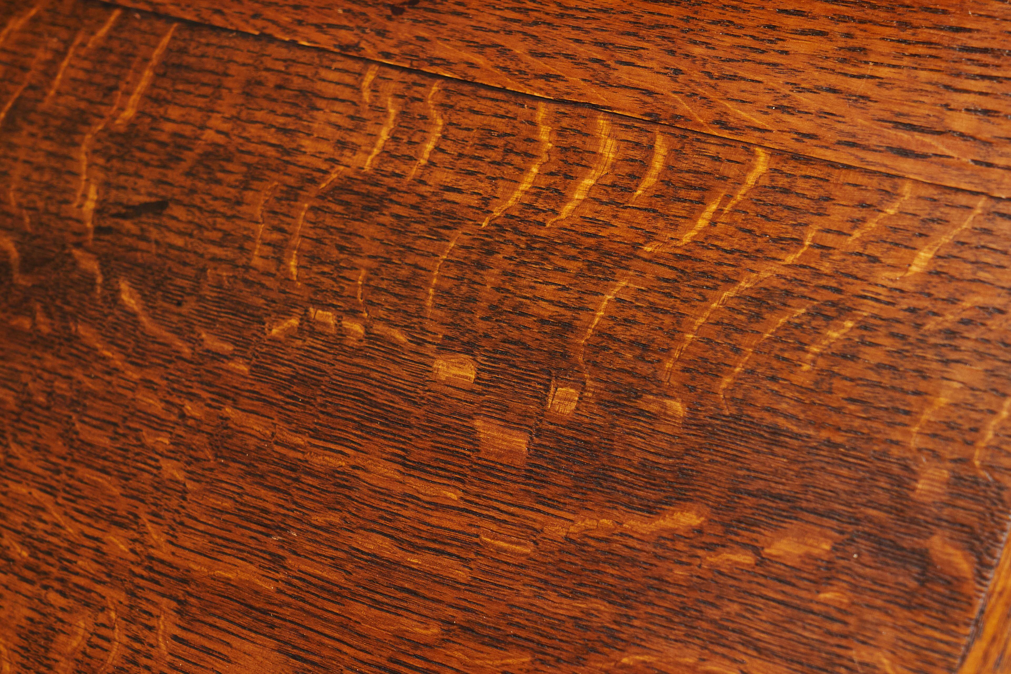 Antique English oak secretary with drop-down front.