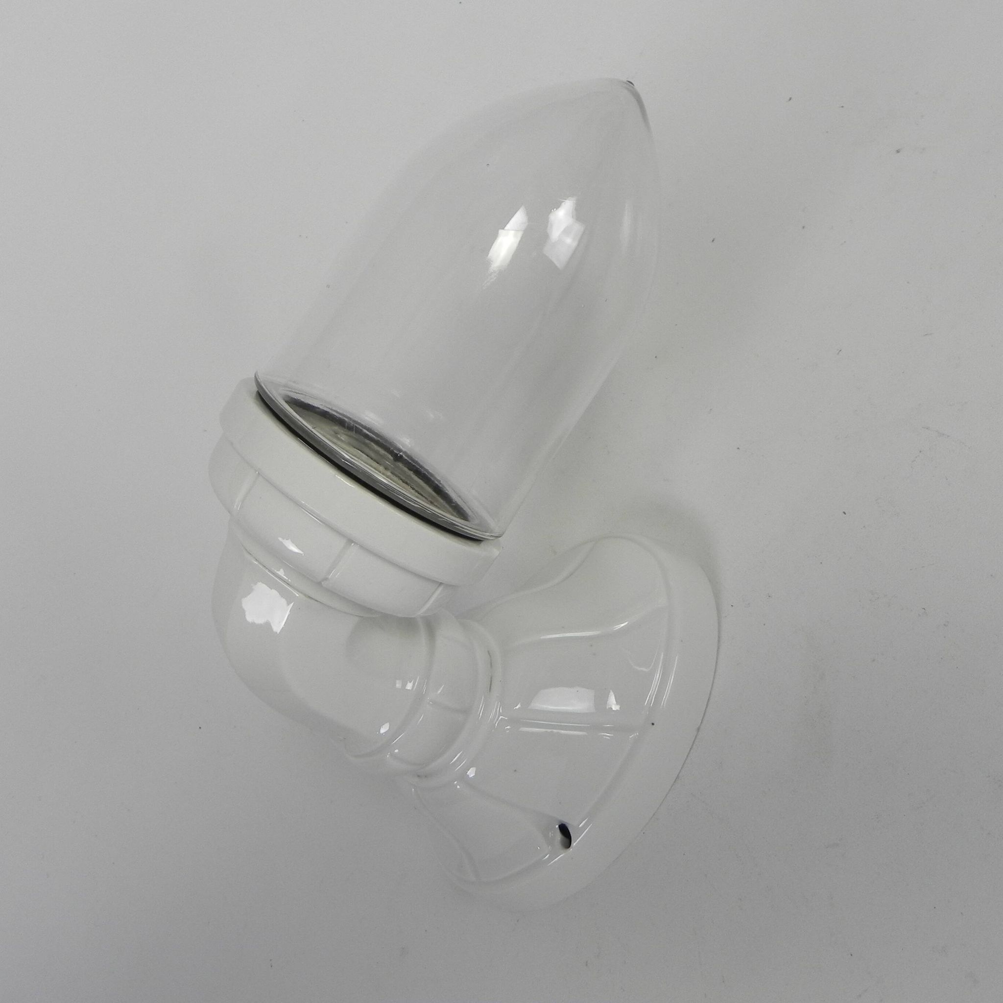 Wall lamp in porcelain with a transparent glass shade, 1930s.