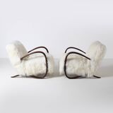 Pair of Jindrich Halabala H 269 lounge chairs in mongolian sheepskin