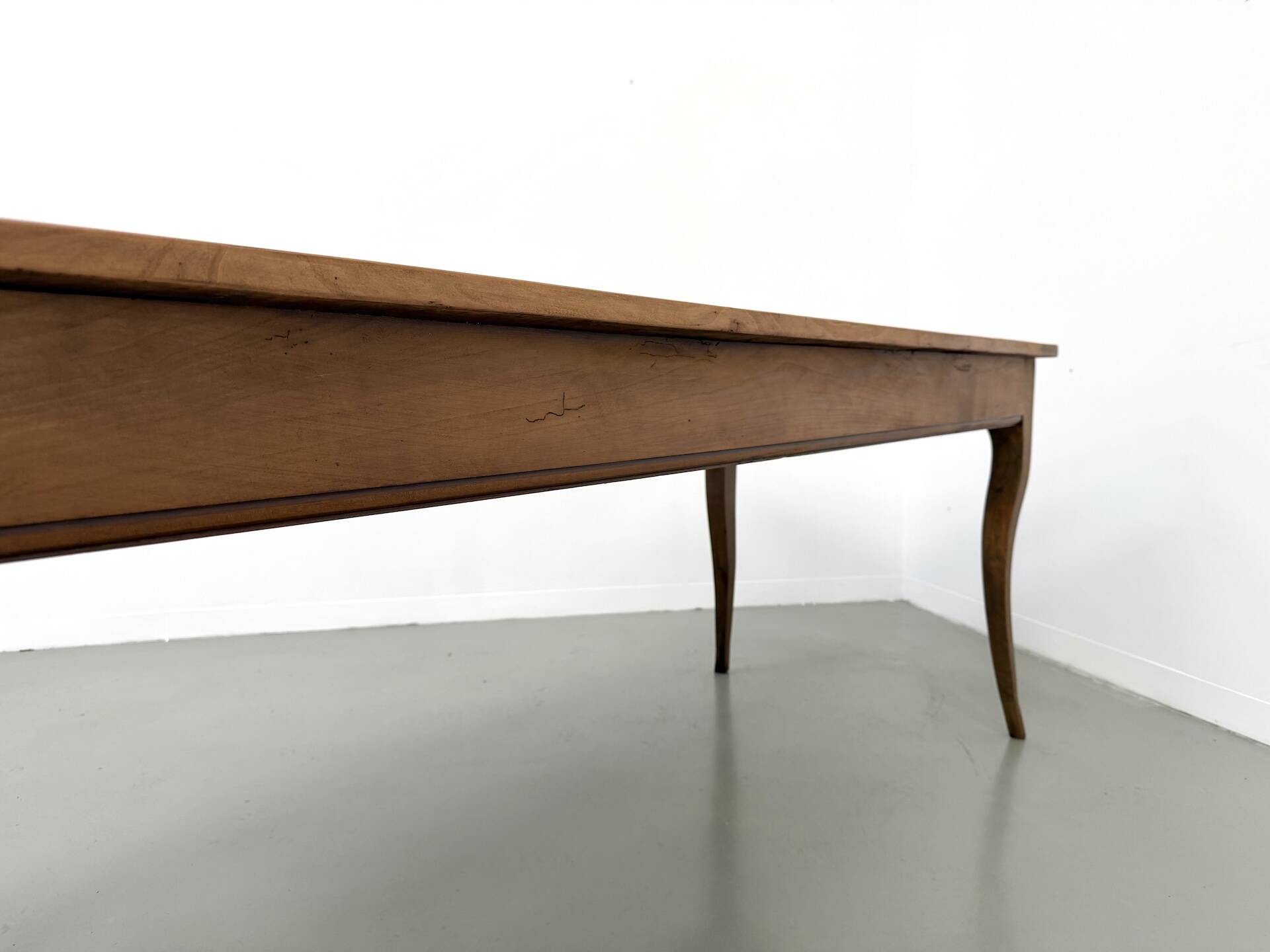 Farm table in solid cherry — Saber legs, Circa 1880