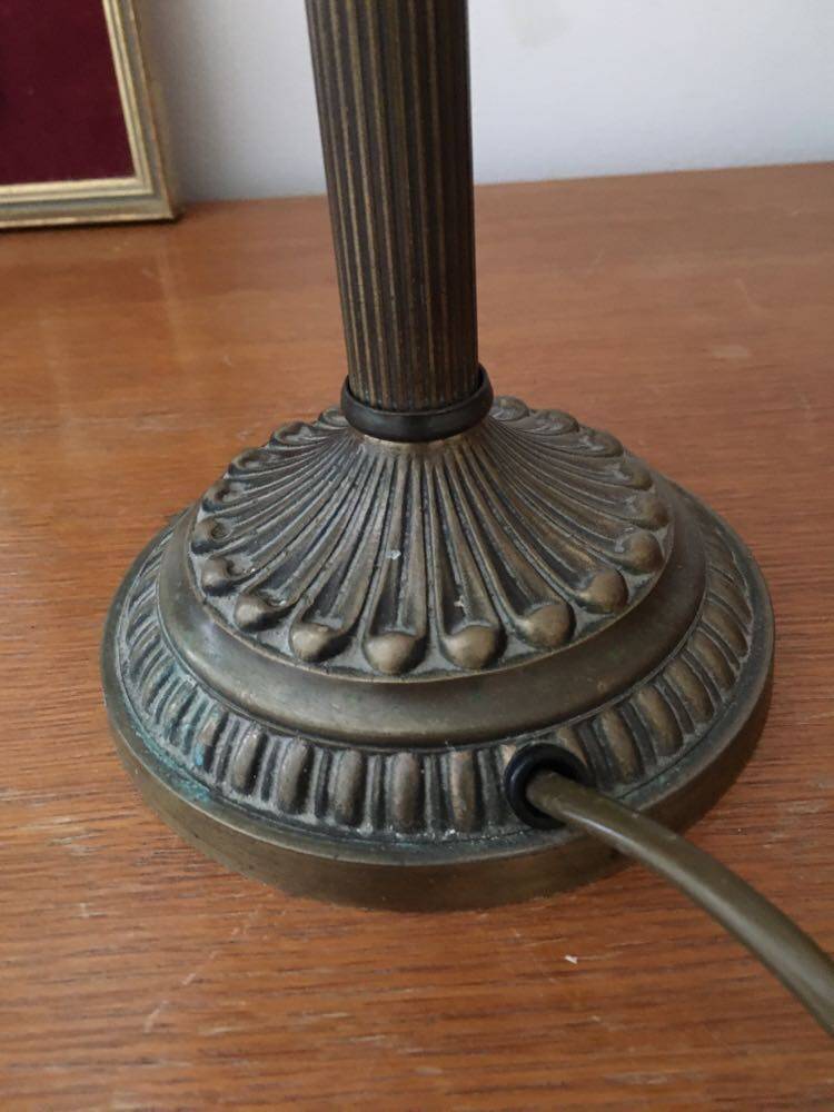 Old table/bedside lamp with glass shade with pink gradients and fringes.