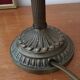 Old table/bedside lamp with glass shade with pink gradients and fringes.