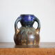 Blue vase in flaming sandstone